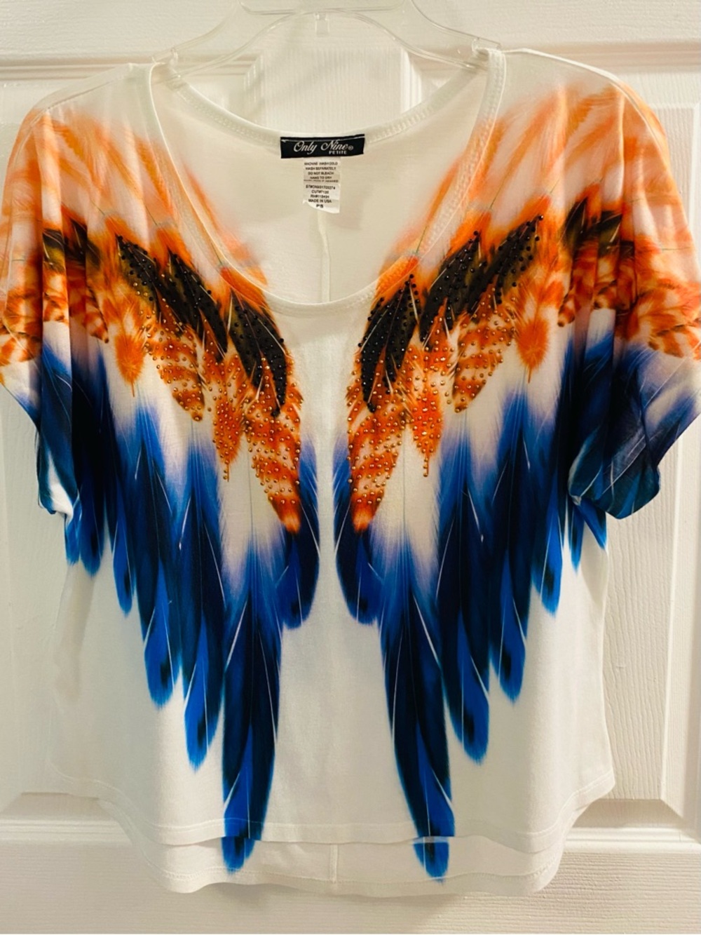 Only Mine White Short Sleeve Top with Blue and Orange Feather Motif
